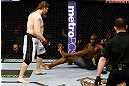 NEWARK, NJ - APRIL 27:  Cheick Kongo (R) of France sits against the cage as Roy Nelson (L) approaches in their heavyweight bout during the UFC 159 event at the Prudential Center on April 27, 2013 in Newark, New Jersey.  (Photo by Al Bello/Zuffa LLC/Zuffa LLC Via Getty Images)