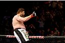 NEWARK, NJ - APRIL 27:  Roy Nelson sits on the side of the octagon in celebration of his win by knockout against Cheick Kongo of France in their heavyweight bout during the UFC 159 event at the Prudential Center on April 27, 2013 in Newark, New Jersey.  (Photo by Al Bello/Zuffa LLC/Zuffa LLC Via Getty Images)