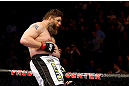 NEWARK, NJ - APRIL 27:  Roy Nelson sits on the side of the octagon in celebration of his win by knockout against Cheick Kongo of France in their heavyweight bout during the UFC 159 event at the Prudential Center on April 27, 2013 in Newark, New Jersey.  (Photo by Al Bello/Zuffa LLC/Zuffa LLC Via Getty Images)