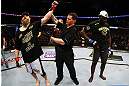 NEWARK, NJ - APRIL 27:  Cheick Kongo (R) of France reacts as Roy Nelson (L) is announced winner by knockout by referee Kevin Mulhall (C) after their heavyweight bout during the UFC 159 event at the Prudential Center on April 27, 2013 in Newark, New Jersey.  (Photo by Al Bello/Zuffa LLC/Zuffa LLC Via Getty Images)