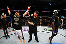 NEWARK, NJ - APRIL 27:  Cheick Kongo (R) of France walks away as Roy Nelson (L) is announced winner by knockout by referee Kevin Mulhall (C) after their heavyweight bout during the UFC 159 event at the Prudential Center on April 27, 2013 in Newark, New Jersey.  (Photo by Al Bello/Zuffa LLC/Zuffa LLC Via Getty Images)