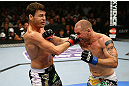NEWARK, NJ - APRIL 27: (L-R) Michael Bisping of England exchanges punches with Alan Belcher in their middleweight bout during the UFC 159 event at the Prudential Center on April 27, 2013 in Newark, New Jersey.  (Photo by Al Bello/Zuffa LLC/Zuffa LLC Via Getty Images)