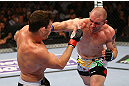 NEWARK, NJ - APRIL 27:  Alan Belcher (R) punches Michael Bisping (L) of England in thier middleweight bout during the UFC 159 event at the Prudential Center on April 27, 2013 in Newark, New Jersey.  (Photo by Al Bello/Zuffa LLC/Zuffa LLC Via Getty Images)
