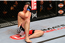 NEWARK, NJ - APRIL 27:  Alan Belcher reacts after being poked in the eye in the third round of his middleweight bout against Michael Bisping of England during the UFC 159 event at the Prudential Center on April 27, 2013 in Newark, New Jersey.  (Photo by Al Bello/Zuffa LLC/Zuffa LLC Via Getty Images)