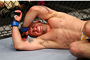 NEWARK, NJ - APRIL 27:  Alan Belcher reacts after being poked in the eye in the third round of his middleweight bout against Michael Bisping of England during the UFC 159 event at the Prudential Center on April 27, 2013 in Newark, New Jersey.  (Photo by Al Bello/Zuffa LLC/Zuffa LLC Via Getty Images)