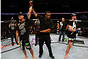 NEWARK, NJ - APRIL 27: Michael Bisping (L) of England is announced winner by unanimous decision against Alan Belcher (R) in their middleweight bout during the UFC 159 event at the Prudential Center on April 27, 2013 in Newark, New Jersey.  (Photo by Al Bello/Zuffa LLC/Zuffa LLC Via Getty Images)