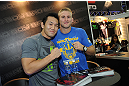 LAS VEGAS, NV - JULY 7:   Yushin Okami and Alexander Gustafsson pose for pictures during the UFC Fan Expo at the Mandalay Bay Convention Center on July 7, 2012 in Las Vegas, Nevada.  (Photo by Al Powers/Zuffa LLC/Zuffa LLC via Getty Images)  *** Local Caption ***