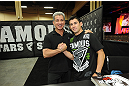 LAS VEGAS, NV - JULY 06:  Dominick Cruz and Bruce Buffer in attendance at the UFC Fan Expo on July 6, 2012 in Las Vegas, Nevada. (Photo by Al Powers /Zuffa LLC/Zuffa LLC via Getty Images)