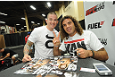 LAS VEGAS, NV - JULY 06:  Clay Guida poses with a fan at the UFC Fan Expo on July 6, 2012 in Las Vegas, Nevada. (Photo by Al Powers /Zuffa LLC/Zuffa LLC via Getty Images)