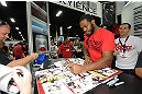 LAS VEGAS, NV - JULY 06:  UFC light heavyweight champion Jon "Bones" Jones signs autographs for fans at UFC Fan Expo on July 6, 2012 in Las Vegas, Nevada. (Photo by Al Powers /Zuffa LLC/Zuffa LLC via Getty Images)