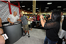 LAS VEGAS, NV - JULY 06: Goerges St-Pierre poses for pictures with a fan from the UFC Fan Expo on July 6, 2012 in Las Vegas, Nevada. (Photo by Al Powers /Zuffa LLC/Zuffa LLC via Getty Images)