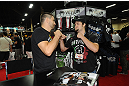 LAS VEGAS, NV - JULY 7:  Carlos Condit faces off with a fan during the UFC Fan Expo at the Mandalay Bay Convention Center on July 7, 2012 in Las Vegas, Nevada.  (Photo by Al Powers/Zuffa LLC/Zuffa LLC via Getty Images)  *** Local Caption ***