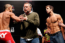 JARAGUA DO SUL, BRAZIL - MAY 17: (L-R) Opponents Vitor Belfort and Luke Rockhold are separated after a heated face-off during the UFC on FX weigh-in on May 17, 2013 at the Arena Jaragua in Jaragua do Sul, Santa Catarina, Brazil. (Photo by Josh Hedges/Zuffa LLC/Zuffa LLC via Getty Images)