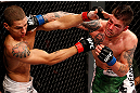 JARAGUA DO SUL, BRAZIL - MAY 18: (R-L) Jeremy Larsen punches Lucas Martins in their lightweight bout during the UFC on FX event on May 18, 2013 at Arena Jaragua in Jaragua do Sul, Santa Catarina, Brazil. (Photo by Josh Hedges/Zuffa LLC/Zuffa LLC via Getty Images)