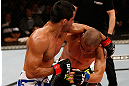 JARAGUA DO SUL, BRAZIL - MAY 18:   (L-R) Jussier Formiga punches Chris Cariaso in their flyweight bout during the UFC on FX event on May 18, 2013 at Arena Jaragua in Jaragua do Sul, Santa Catarina, Brazil.  (Photo by Josh Hedges/Zuffa LLC/Zuffa LLC via Getty Images)