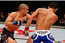 JARAGUA DO SUL, BRAZIL - MAY 18:   (L-R) Chris Cariaso punches Jussier Formiga in their flyweight bout during the UFC on FX event on May 18, 2013 at Arena Jaragua in Jaragua do Sul, Santa Catarina, Brazil.  (Photo by Josh Hedges/Zuffa LLC/Zuffa LLC via Getty Images)