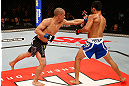 JARAGUA DO SUL, BRAZIL - MAY 18:   (L-R) Chris Cariaso punches Jussier Formiga in their flyweight bout during the UFC on FX event on May 18, 2013 at Arena Jaragua in Jaragua do Sul, Santa Catarina, Brazil.  (Photo by Josh Hedges/Zuffa LLC/Zuffa LLC via Getty Images)