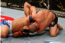 JARAGUA DO SUL, BRAZIL - MAY 18:   (R-L) Chris Cariaso attempts a guillotine choke submission against Jussier Formiga in their flyweight bout during the UFC on FX event on May 18, 2013 at Arena Jaragua in Jaragua do Sul, Santa Catarina, Brazil.  (Photo by Josh Hedges/Zuffa LLC/Zuffa LLC via Getty Images)