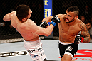 JARAGUA DO SUL, BRAZIL - MAY 18:   (R-L) John Lineker punches Azamat Gashimov in their flyweight bout during the UFC on FX event on May 18, 2013 at Arena Jaragua in Jaragua do Sul, Santa Catarina, Brazil.  (Photo by Josh Hedges/Zuffa LLC/Zuffa LLC via Getty Images)