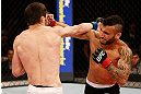 JARAGUA DO SUL, BRAZIL - MAY 18:   (R-L) John Lineker punches Azamat Gashimov in their flyweight bout during the UFC on FX event on May 18, 2013 at Arena Jaragua in Jaragua do Sul, Santa Catarina, Brazil.  (Photo by Josh Hedges/Zuffa LLC/Zuffa LLC via Getty Images)