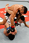 JARAGUA DO SUL, BRAZIL - MAY 18:   (R-L) John Lineker punches Azamat Gashimov in their flyweight bout during the UFC on FX event on May 18, 2013 at Arena Jaragua in Jaragua do Sul, Santa Catarina, Brazil.  (Photo by Josh Hedges/Zuffa LLC/Zuffa LLC via Getty Images)