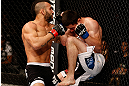 JARAGUA DO SUL, BRAZIL - MAY 18:   (L-R) John Lineker punches Azamat Gashimov in their flyweight bout during the UFC on FX event on May 18, 2013 at Arena Jaragua in Jaragua do Sul, Santa Catarina, Brazil.  (Photo by Josh Hedges/Zuffa LLC/Zuffa LLC via Getty Images)