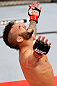 JARAGUA DO SUL, BRAZIL - MAY 18:   John Lineker reacts after knocking out Azamat Gashimov in their flyweight bout during the UFC on FX event on May 18, 2013 at Arena Jaragua in Jaragua do Sul, Santa Catarina, Brazil.  (Photo by Josh Hedges/Zuffa LLC/Zuffa LLC via Getty Images)