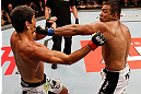 JARAGUA DO SUL, BRAZIL - MAY 18:   (R-L) Michel Prazeres punches Paulo Thiago in their welterweight bout during the UFC on FX event on May 18, 2013 at Arena Jaragua in Jaragua do Sul, Santa Catarina, Brazil.  (Photo by Josh Hedges/Zuffa LLC/Zuffa LLC via Getty Images)