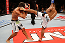 JARAGUA DO SUL, BRAZIL - MAY 18: (R-L) Michel Prazeres kicks Paulo Thiago in their welterweight bout during the UFC on FX event on May 18, 2013 at Arena Jaragua in Jaragua do Sul, Santa Catarina, Brazil. (Photo by Josh Hedges/Zuffa LLC/Zuffa LLC via Getty Images)