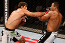 JARAGUA DO SUL, BRAZIL - MAY 18:   (L-R) Paulo Thiago punches Michel Prazeres in their welterweight bout during the UFC on FX event on May 18, 2013 at Arena Jaragua in Jaragua do Sul, Santa Catarina, Brazil.  (Photo by Josh Hedges/Zuffa LLC/Zuffa LLC via Getty Images)