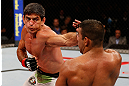 JARAGUA DO SUL, BRAZIL - MAY 18:   (L-R) Paulo Thiago punches Michel Prazeres in their welterweight bout during the UFC on FX event on May 18, 2013 at Arena Jaragua in Jaragua do Sul, Santa Catarina, Brazil.  (Photo by Josh Hedges/Zuffa LLC/Zuffa LLC via Getty Images)