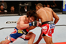 JARAGUA DO SUL, BRAZIL - MAY 18:   (R-L) Francisco Trinaldo punches Mike Rio in their lightweight bout during the UFC on FX event on May 18, 2013 at Arena Jaragua in Jaragua do Sul, Santa Catarina, Brazil.  (Photo by Josh Hedges/Zuffa LLC/Zuffa LLC via Getty Images)