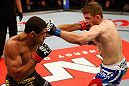 JARAGUA DO SUL, BRAZIL - MAY 18: (L-R) Hacran Dias punches Nik Lentz in their featherweight bout during the UFC on FX event on May 18, 2013 at Arena Jaragua in Jaragua do Sul, Santa Catarina, Brazil. (Photo by Josh Hedges/Zuffa LLC/Zuffa LLC via Getty Images)