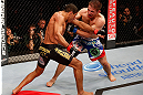 JARAGUA DO SUL, BRAZIL - MAY 18: (L-R) Hacran Dias punches Nik Lentz in their featherweight bout during the UFC on FX event on May 18, 2013 at Arena Jaragua in Jaragua do Sul, Santa Catarina, Brazil. (Photo by Josh Hedges/Zuffa LLC/Zuffa LLC via Getty Images)