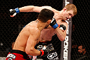 JARAGUA DO SUL, BRAZIL - MAY 18: (L-R) Rafael dos Anjos punches Evan Dunham in their lightweight bout during the UFC on FX event on May 18, 2013 at Arena Jaragua in Jaragua do Sul, Santa Catarina, Brazil. (Photo by Josh Hedges/Zuffa LLC/Zuffa LLC via Getty Images)
