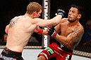 JARAGUA DO SUL, BRAZIL - MAY 18: (L-R) Evan Dunham punches Rafael dos Anjos in their lightweight bout during the UFC on FX event on May 18, 2013 at Arena Jaragua in Jaragua do Sul, Santa Catarina, Brazil. (Photo by Josh Hedges/Zuffa LLC/Zuffa LLC via Getty Images)