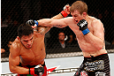 JARAGUA DO SUL, BRAZIL - MAY 18: (R-L) Evan Dunham punches Rafael dos Anjos in their lightweight bout during the UFC on FX event on May 18, 2013 at Arena Jaragua in Jaragua do Sul, Santa Catarina, Brazil. (Photo by Josh Hedges/Zuffa LLC/Zuffa LLC via Getty Images)