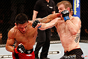 JARAGUA DO SUL, BRAZIL - MAY 18: (R-L) Evan Dunham and Rafael dos Anjos trade punches in their lightweight bout during the UFC on FX event on May 18, 2013 at Arena Jaragua in Jaragua do Sul, Santa Catarina, Brazil. (Photo by Josh Hedges/Zuffa LLC/Zuffa LLC via Getty Images)