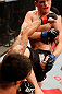 JARAGUA DO SUL, BRAZIL - MAY 18: (L-R) Rafael dos Anjos punches Evan Dunham in their lightweight bout during the UFC on FX event on May 18, 2013 at Arena Jaragua in Jaragua do Sul, Santa Catarina, Brazil. (Photo by Josh Hedges/Zuffa LLC/Zuffa LLC via Getty Images)