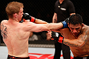 JARAGUA DO SUL, BRAZIL - MAY 18: (L-R) Evan Dunham and Rafael dos Anjos trade punches in their lightweight bout during the UFC on FX event on May 18, 2013 at Arena Jaragua in Jaragua do Sul, Santa Catarina, Brazil. (Photo by Josh Hedges/Zuffa LLC/Zuffa LLC via Getty Images)