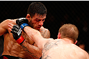 JARAGUA DO SUL, BRAZIL - MAY 18: (R-L) Rafael dos Anjos punches Evan Dunham in their lightweight bout during the UFC on FX event on May 18, 2013 at Arena Jaragua in Jaragua do Sul, Santa Catarina, Brazil. (Photo by Josh Hedges/Zuffa LLC/Zuffa LLC via Getty Images)
