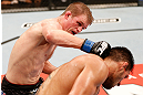 JARAGUA DO SUL, BRAZIL - MAY 18:   (L-R) Evan Dunham punches Rafael dos Anjos in their lightweight bout during the UFC on FX event on May 18, 2013 at Arena Jaragua in Jaragua do Sul, Santa Catarina, Brazil.  (Photo by Josh Hedges/Zuffa LLC/Zuffa LLC via Getty Images)