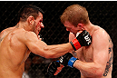 JARAGUA DO SUL, BRAZIL - MAY 18:   (L-R) Rafael dos Anjos punches Evan Dunham in their lightweight bout during the UFC on FX event on May 18, 2013 at Arena Jaragua in Jaragua do Sul, Santa Catarina, Brazil.  (Photo by Josh Hedges/Zuffa LLC/Zuffa LLC via Getty Images)