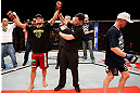 JARAGUA DO SUL, BRAZIL - MAY 18:   Rafael dos Anjos (L) reacts after defeating Evan Dunham in their lightweight bout during the UFC on FX event on May 18, 2013 at Arena Jaragua in Jaragua do Sul, Santa Catarina, Brazil.  (Photo by Josh Hedges/Zuffa LLC/Zuffa LLC via Getty Images)