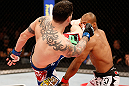 JARAGUA DO SUL, BRAZIL - MAY 18:   (L-R) Chris Camozzi kicks Ronaldo "Jacare" Souza in their middleweight bout during the UFC on FX event on May 18, 2013 at Arena Jaragua in Jaragua do Sul, Santa Catarina, Brazil.  (Photo by Josh Hedges/Zuffa LLC/Zuffa LLC via Getty Images)