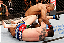 JARAGUA DO SUL, BRAZIL - MAY 18:   (L-R) Ronaldo 'Jacare' Souza punches Chris Camozzi in their middleweight bout during the UFC on FX event on May 18, 2013 at Arena Jaragua in Jaragua do Sul, Santa Catarina, Brazil.  (Photo by Josh Hedges/Zuffa LLC/Zuffa LLC via Getty Images)