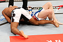JARAGUA DO SUL, BRAZIL - MAY 18:   (L-R) Ronaldo 'Jacare' Souza secures an arm triangle choke submission against Chris Camozzi in their middleweight bout during the UFC on FX event on May 18, 2013 at Arena Jaragua in Jaragua do Sul, Santa Catarina, Brazil.  (Photo by Josh Hedges/Zuffa LLC/Zuffa LLC via Getty Images)