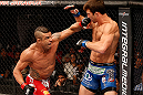 JARAGUA DO SUL, BRAZIL - MAY 18:   (L-R) Vitor Belfort punches Luke Rockhold in their middleweight bout during the UFC on FX event on May 18, 2013 at Arena Jaragua in Jaragua do Sul, Santa Catarina, Brazil.  (Photo by Josh Hedges/Zuffa LLC/Zuffa LLC via Getty Images)
