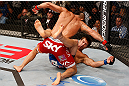 JARAGUA DO SUL, BRAZIL - MAY 18: (L-R) Vitor Belfort finishes Luke Rockhold with punches after knocking him down with a spinning heel kick in their middleweight bout during the UFC on FX event on May 18, 2013 at Arena Jaragua in Jaragua do Sul, Santa Catarina, Brazil. (Photo by Josh Hedges/Zuffa LLC/Zuffa LLC via Getty Images)