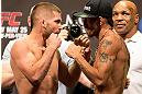 LAS VEGAS, NV - MAY 24:   (L-R) Opponents Jeremy Stephens and Estevan Payan face off during the UFC 160 weigh-in at the MGM Grand Garden Arena on May 24, 2013 in Las Vegas, Nevada.  (Photo by Josh Hedges/Zuffa LLC/Zuffa LLC via Getty Images)